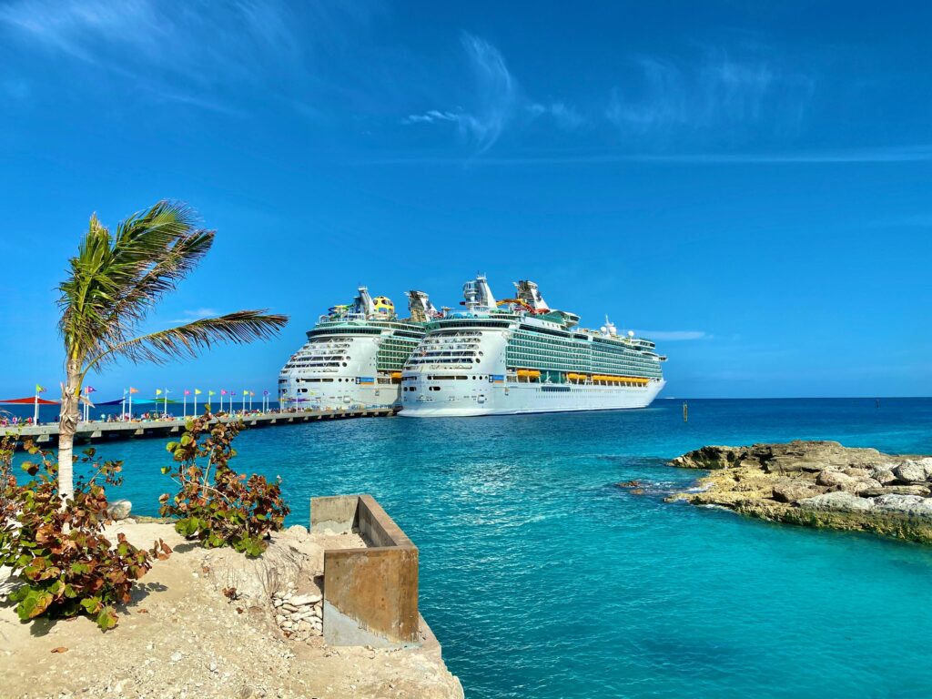 pexels-photo-4092994-4092994 Similar big cruise ships sailing on rippled sea surrounded by small dry exotic islands and boardwalk under colorful blue sky in daylight in harbor